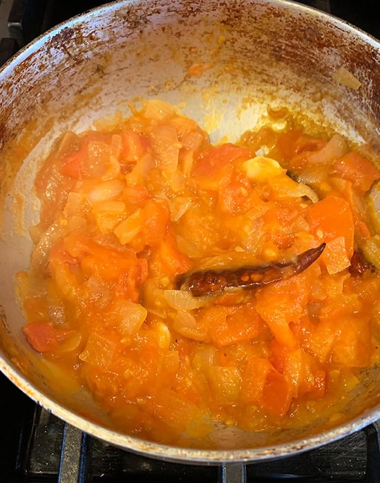 soft cooked tomatoes in a kadai