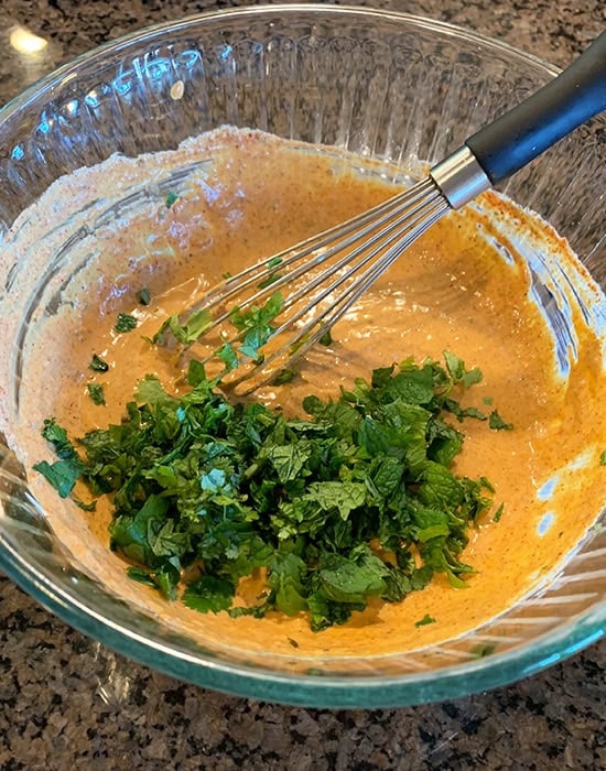 fresh herbs added to marinade