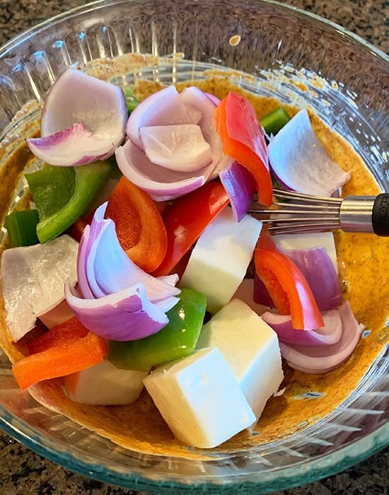 paneer cubes and bell peppers added to marinade