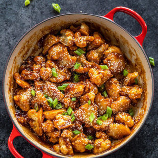 sesame cauliflower served in a red pan