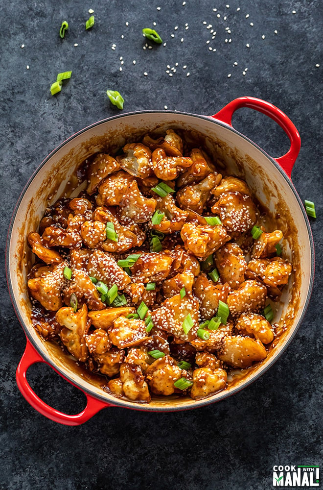 sesame cauliflower served in a red pan