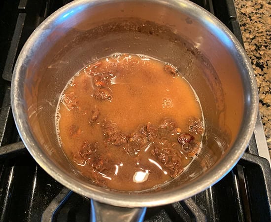tamarind soaked in water in a saucepan