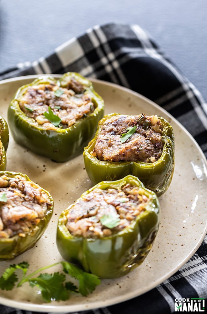 potato stuffed bell peppers arrange on a white plate