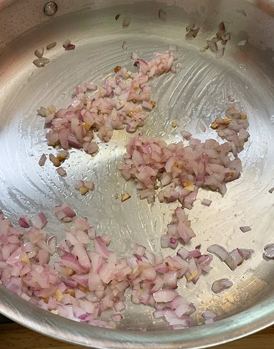 chopped onion in a steel pan