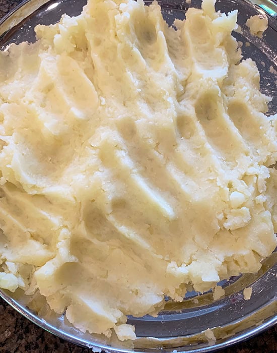 boiled and mashed potatoes in a plate