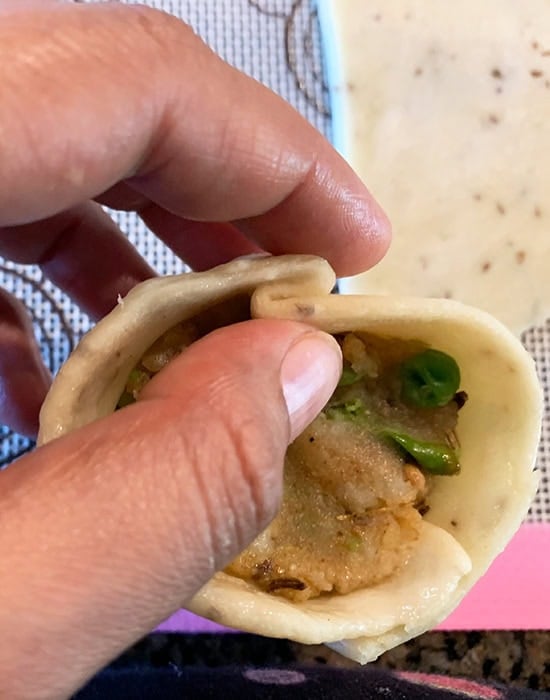 pinching samosa dough