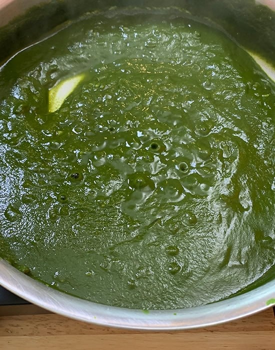 green spinach puree in a steel pan