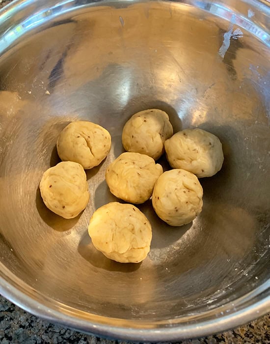 small dough balls in a steel bowl