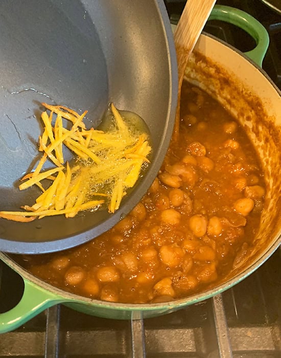 ginger being added to chole