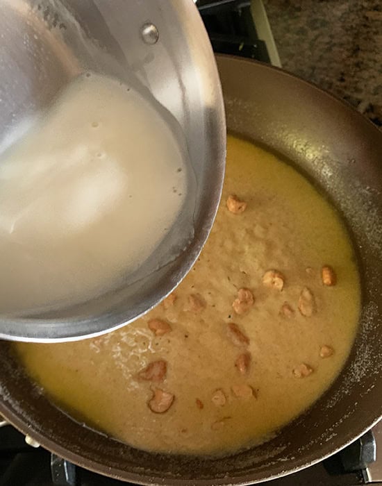 adding liquids to a pan