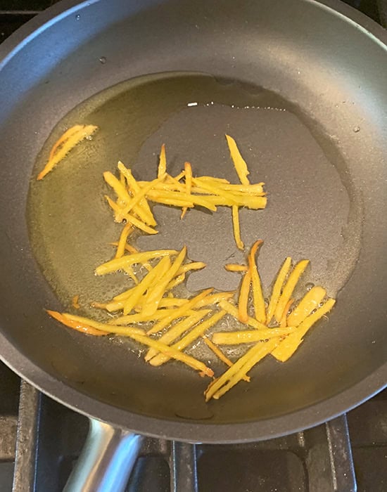 ginger juliennes being fried in ghee