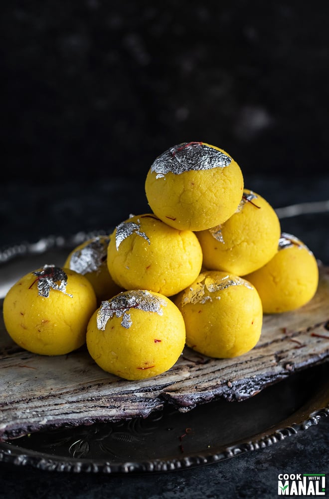 stack of kesar malai ladoo arranged on a tray