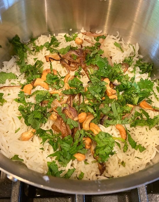 cashews, mint, cilantro layered on top of rice