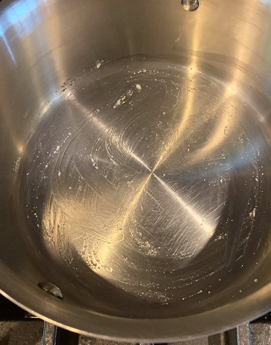 steel pot greased with ghee