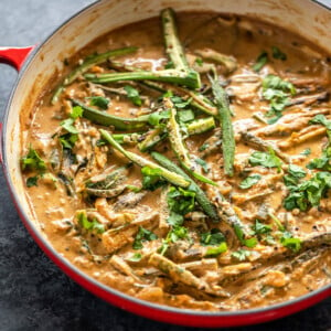 okra curry served in a red pan