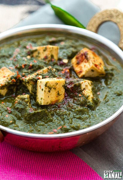 palak tofu served in a copper kadai