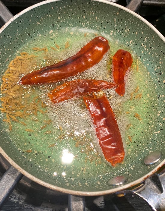 tadka of dried red chilies and cumin seeds