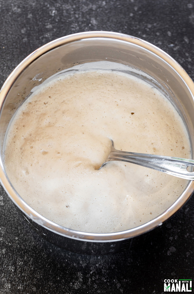 fermented dosa batter in a steel container