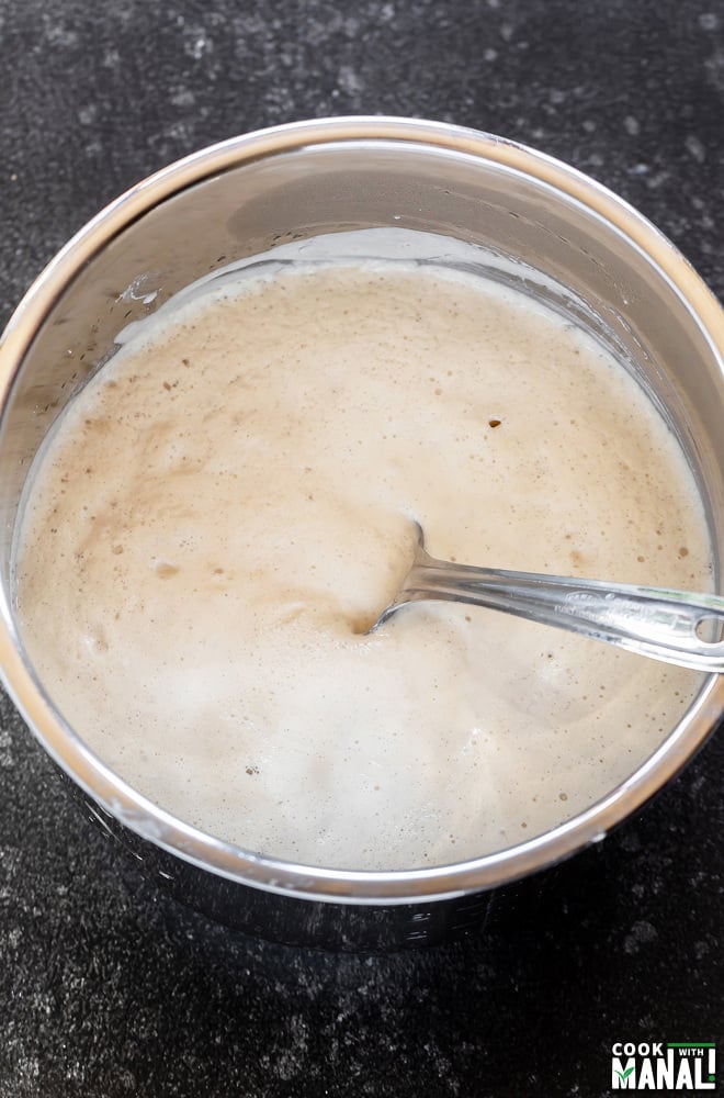 fermented dosa batter in a steel container