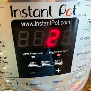 instant pot displaying a timer of 2 minutes