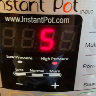 instant pot displaying a timer of 5 minutes at high pressure