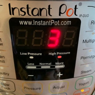 instant pot displaying 3 minutes timer
