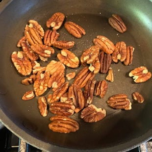 pecans placed in a small pan