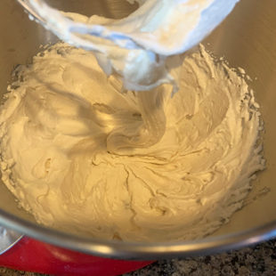 lentil batter being whisked in a stand mixer