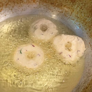 medu vada being fried in hot oil