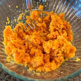 mashed sweet potatoes in a glass bowl