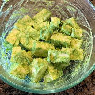 paneer cubes coated with a green color marinade