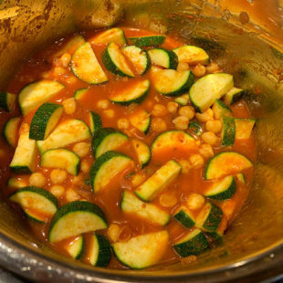 diced zucchini and chickpeas in a tomato based sauce