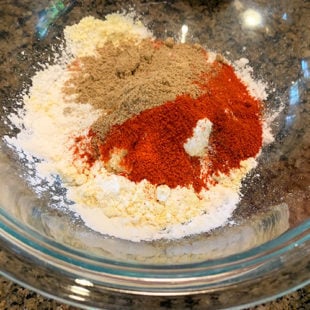bowl with several spices and flour