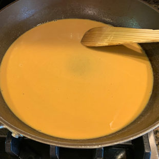 golden color liquid in a pan