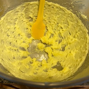 creamed butter in a mixer with a spatula