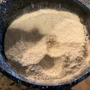 white color ground flour in a grinder