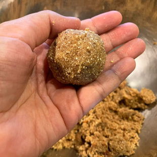 quinoa ladoo placed on a palm