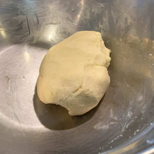 a kneaded dough placed in a bowl