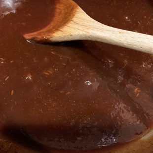 thick brown color chutney in a kadai