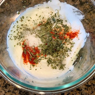 yogurt with spices in a bowl