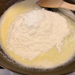 pan with melted butter and milk powder