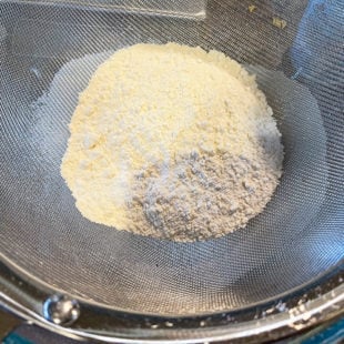 flour in a mesh strainer