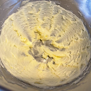 creamed butter in a steel bowl
