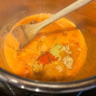 pureed tomatoes with spices in a pot