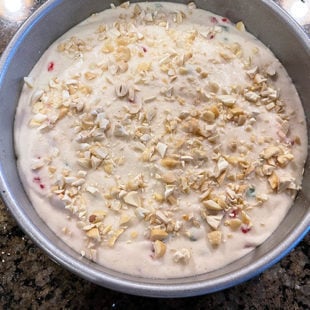 cake batter in a round pan ready to be baked
