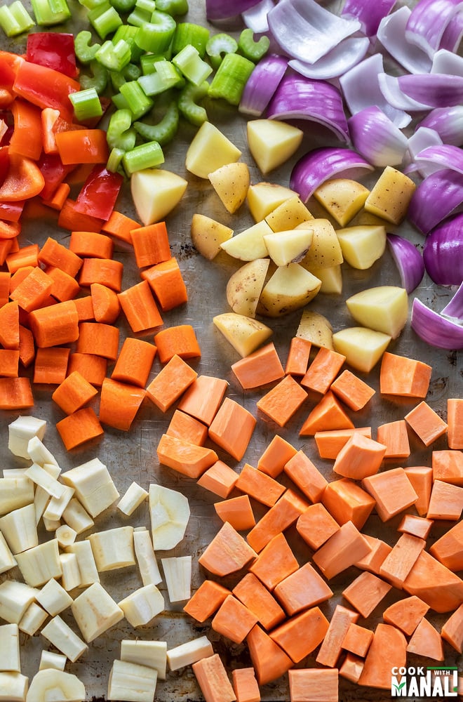 assorted diced vegetables on a baking tray