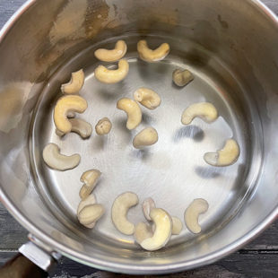cashews in water in a pan