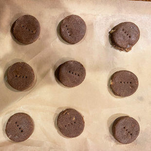 round cookies placed on baking sheet