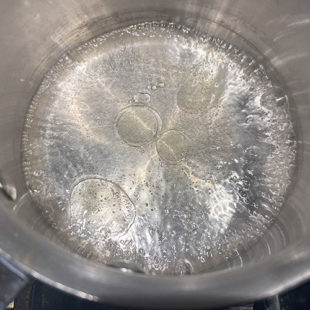 water boiling in a pan with little oil
