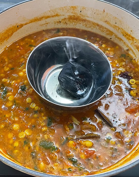 smoking the dal with charcoal